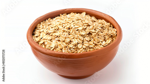 Bowl with raw oatmeal on white background