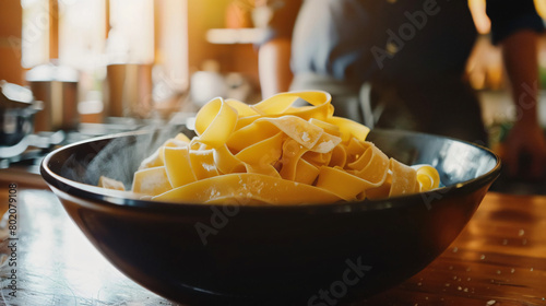 Bowl with uncooked pasta on table closeup 