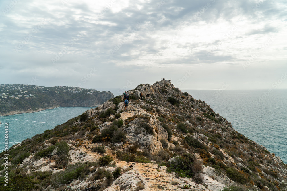 Panoramic view, cliffs and Mediterranean sea on a cloudy morning day, in Jávea, Alicante (Spain).