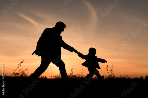 A man and a child are running together in a field