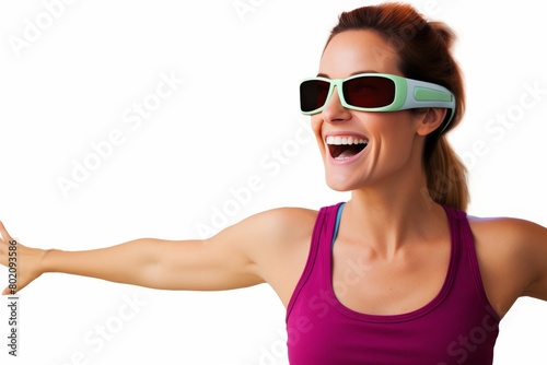 A woman wearing sunglasses and a pink tank top is smiling