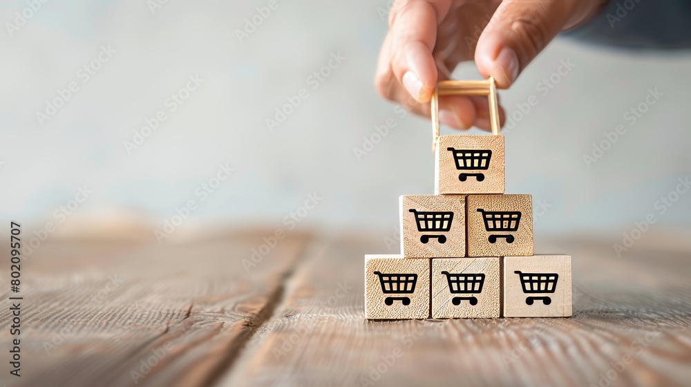 Hand arranging wood block stacking with icon Graph and shopping cart ...