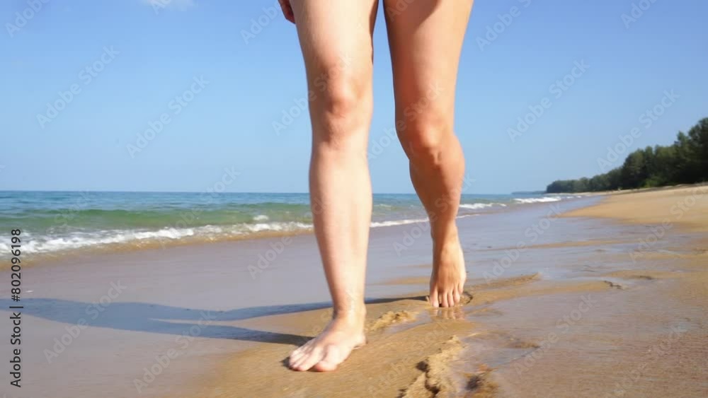 Girl runs along the beach barefoot Girl runs along the beach barefoot