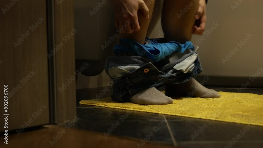 A man is in the toilet, his stomach hurts from food poisoning. Gonorrhea in men, bacterial intestinal infection. A man is in the toilet, his stomach hurts from food poisoning. Gonorrhea in men, bacterial intestinal infection.