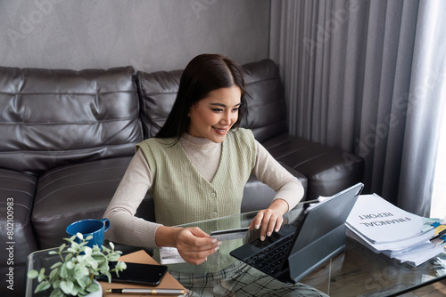 Young woman using credit card and tablet for buying online shopping at home , payment, buying and online shopping concept