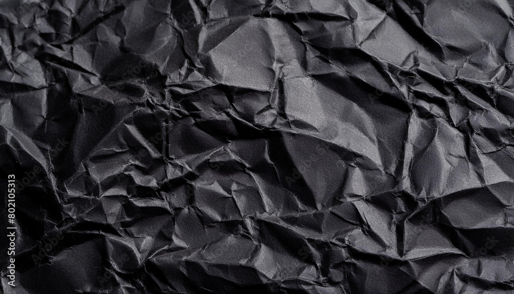 Black crumpled paper texture background with empty space for text Black crumpled paper texture background with empty space for text