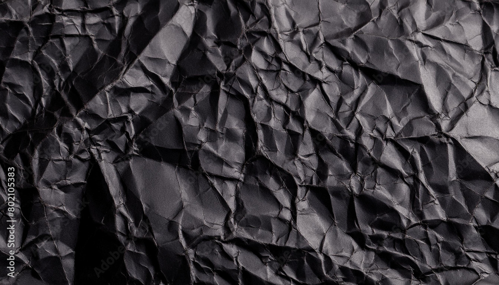 Black crumpled paper texture background with empty space for text Black crumpled paper texture background with empty space for text