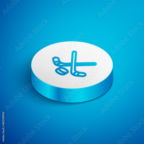 Isometric line Ice hockey sticks and puck icon isolated on blue background. Game start. White circle button. Vector