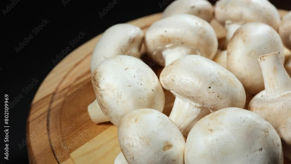 Raw champignon mushrooms, on wooden background. Raw champignon mushrooms, on wooden background.
