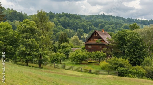 Rustic wooden house nestled in a countryside landscape, surrounded by lush greenery and rolling hills. © buraratn