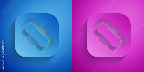 Paper cut Menstruation and sanitary napkin icon isolated on blue and purple background. Feminine hygiene product. Paper art style. Vector