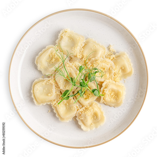 Top view of portion of boiled prepared traditional homemade italian ravioli pasta stuffed with ricotta of square shape decorated with grated cheese and green pea served on plate isolated on white