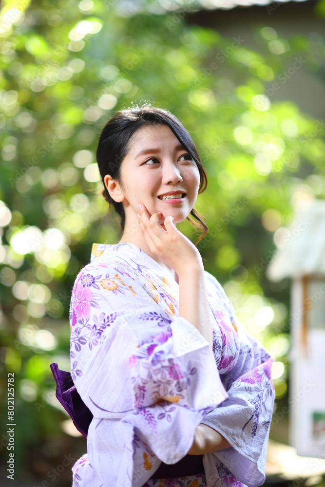 portrait woman with yukata dress in the garden portrait woman with yukata dress in the garden