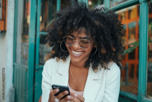 Joyful African American Businesswoman Using Smartphone in Urban Setting