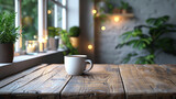 A white coffee cup sits on a wooden table in front of a window