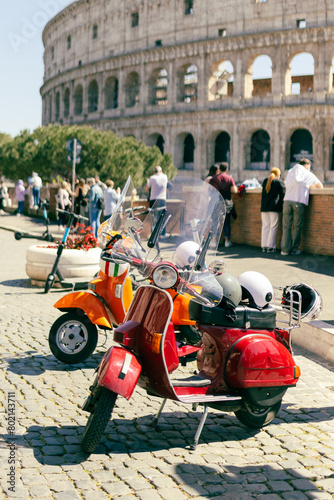 Photography Two Retro scooters stay near the Roman Coliseum