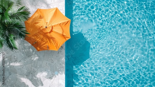 Top view of pool and umbrella sunny day, orange umbrella and palm tree in swimming pool, yellow swimming pool vacation drop sunlight