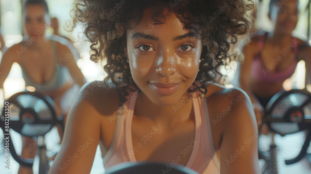 Fototapeta premium Motivational photo of person participating in a group fitness class, enthusiastic instructors leading the gym workout