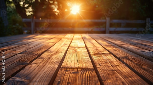 Wooden deck illuminated by golden sunset light  providing a tranquil outdoor setting for leisure and entertainment.