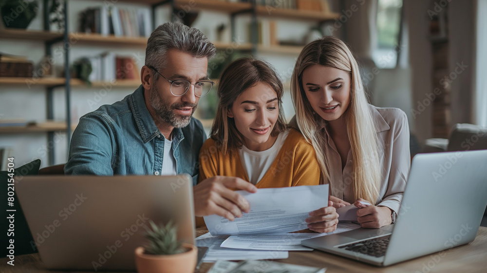 Young couple communicating with insurance agent while analyzing documents during meeting. Young couple communicating with insurance agent while analyzing documents during meeting.