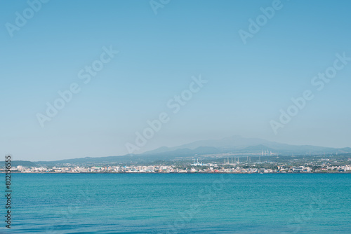 Hallim-eup seaside village and volcanic oreum view from Biyangdo Island in Jeju island, Korea photo