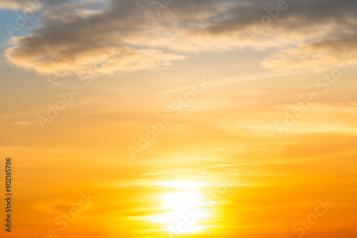 Sunset sky with sun light and sunset clouds background