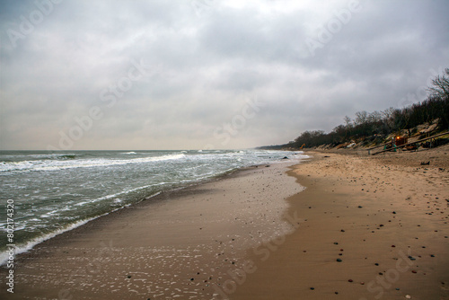Deserted shore of the Baltic Sea in winter with a beach and waves. Zelenogradsk. Kaliningrad region. Russia