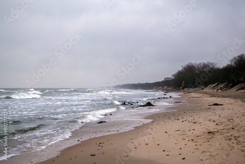 Deserted shore of the Baltic Sea in winter with a beach and waves. Zelenogradsk. Kaliningrad region. Russia