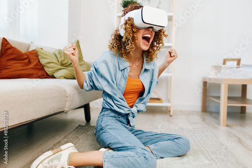Virtual Reality Joy: A Smiling Woman Enjoying Futuristic VR Game in Home Interior photo