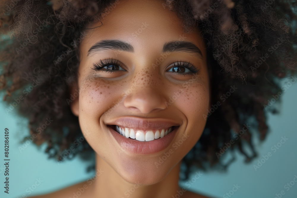 portrait of a smiling girl with curly hair portrait of a smiling girl with curly hair