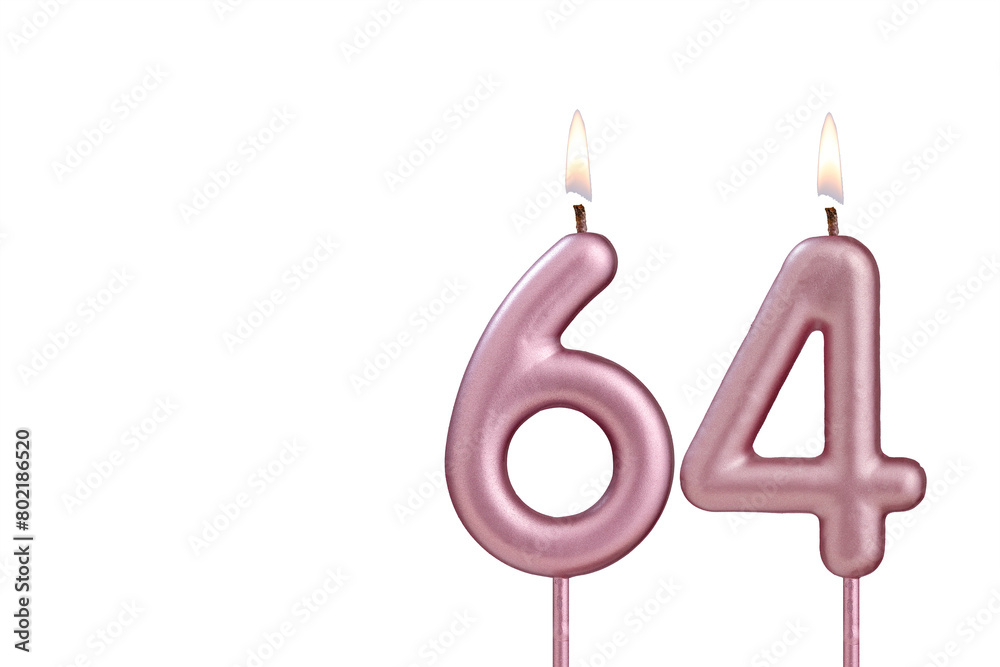 Candle number 64 - Lit birthday candle on white background Candle number 64 - Lit birthday candle on white background