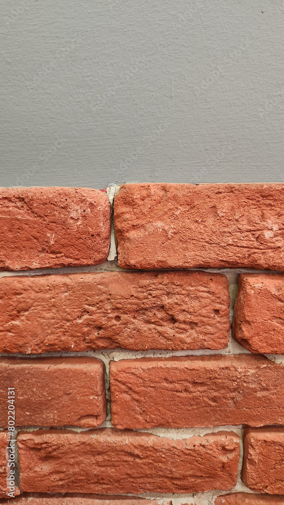 Obraz premium half gray painted half brick covered wall background