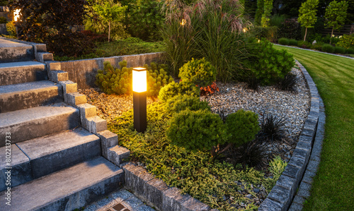 LED Outdoor Light Post in a Beautiful Residential Rockery Garden © Tomasz Zajda