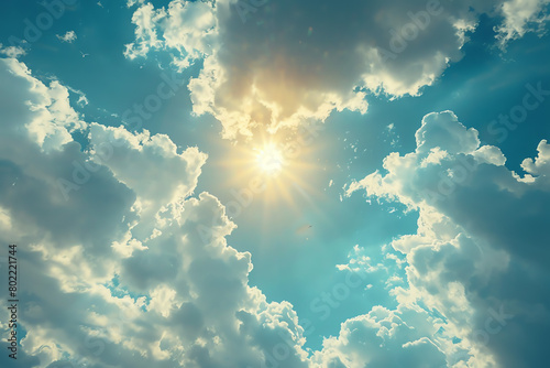 Sunlight breaks through clouds in a clear blue sky during midday