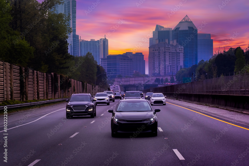 Car driving on freeway at sunset, Car driving on freeway at sunset,