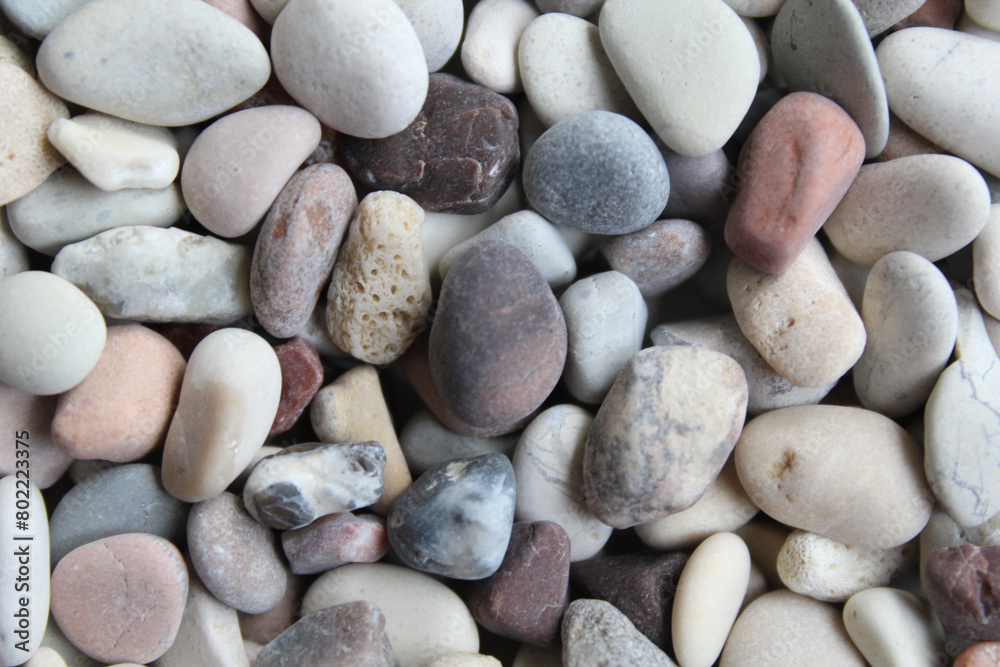 Background texture of pebbles or small river stone, flat lay or top view Background texture of pebbles or small river stone, flat lay or top view
