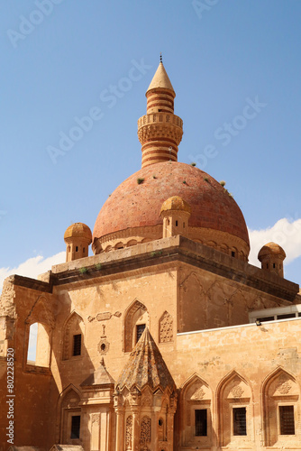 Ottoman tomb in front of the red roof, cupola, dome of the mosque in the second court inside the Ishak Pasha Palace, Sarayi, Dogubeyazit, Turkey
