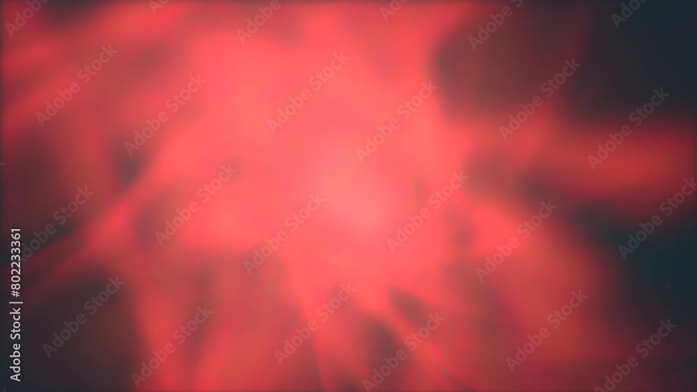 A vibrant red background with a bright light in the center creates a ...