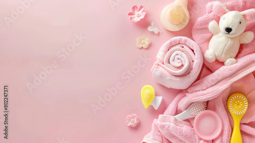 Different bath accessories for baby on pink background