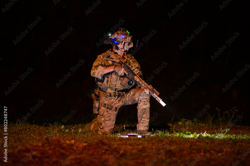 Fototapeta premium Soldiers ready to fire during Military Operation at night