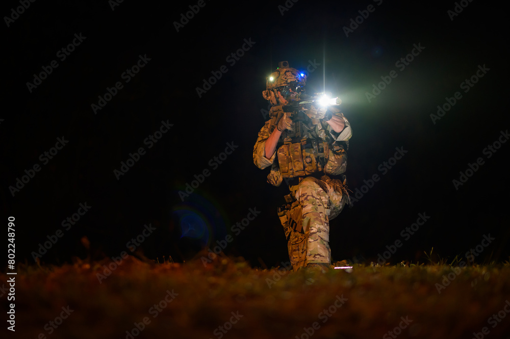 Obraz premium Soldiers ready to fire during Military Operation at night