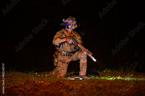 Soldiers ready to fire during Military Operation at night