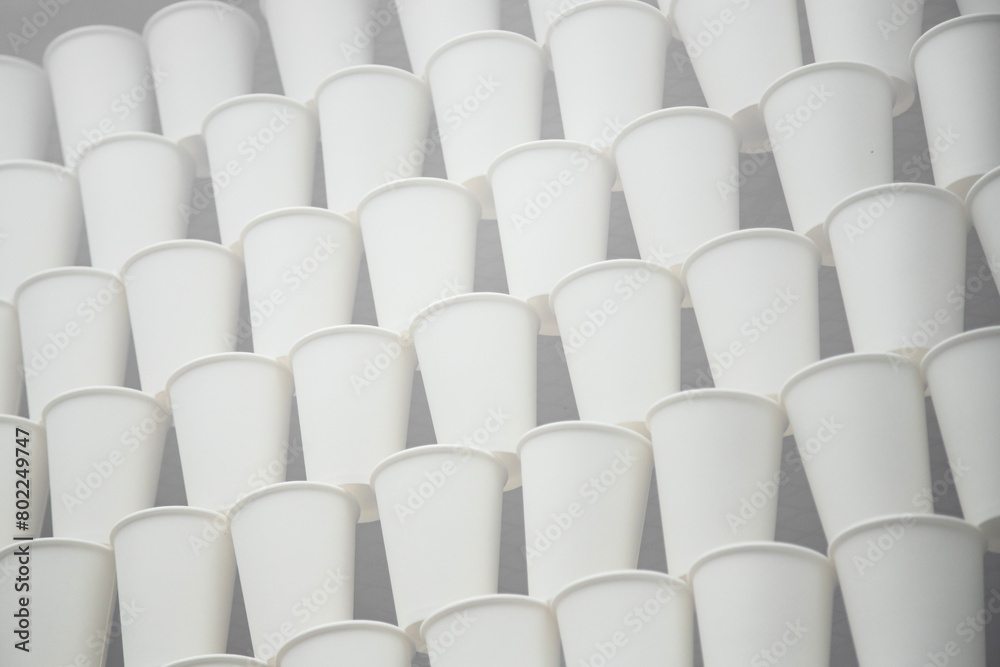 Fototapeta premium white paper cups on the gray background . soft focus