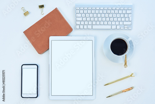 Tablet, phone and mockup screen above for social media, tech and business for content creation work. Desk, creative space and workspace with startup technology and coffee in a seo optimization office