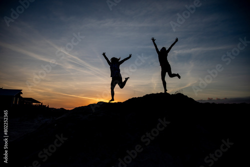 silhouette of a person jumping