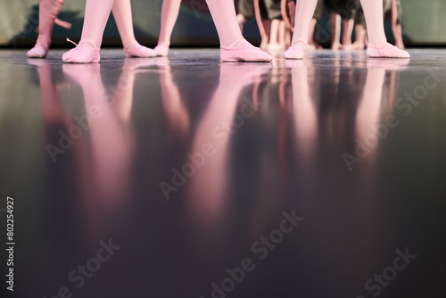 Children demonstrate art on stage. Classic children's choreography with the possibility of copying. A group of children, many legs are standing on the stage. High quality photo