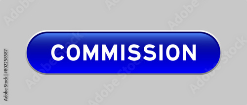 Blue color capsule shape button with word comission on gray background