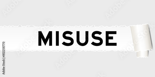 Ripped gray paper background that have word misuse under torn part