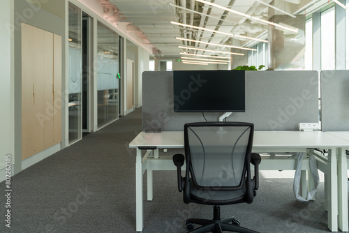 Interior of modern empty office building.Open ceiling design.Equipped with automatic lifting table and LCD screen.