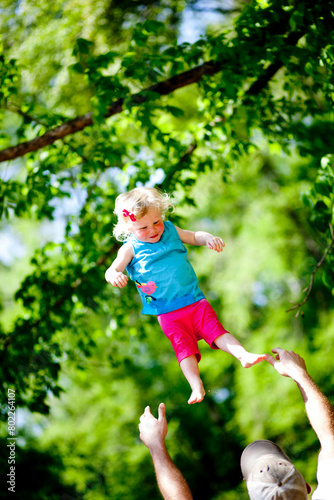 Throwing little girl in the air 